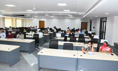 Collector Jitesh V Patil conducts an awareness seminar on the Dalit Bandhu scheme at a meeting of district-level officials