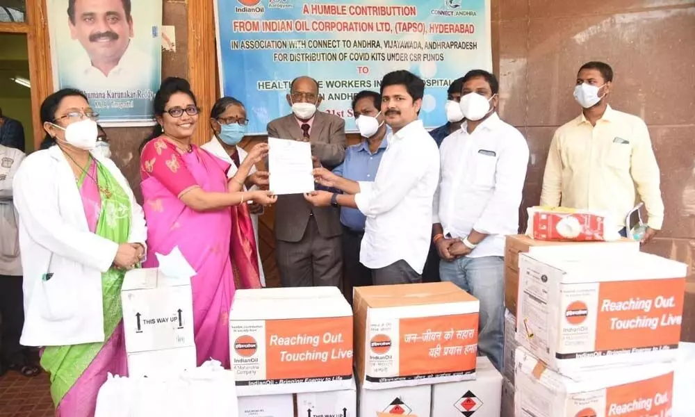 Tirupati MP Dr M Gurumoorthy handing over medical kits to Ruia hospital Superintendent Dr T Bharathi on Tuesday. Koteswaramma, Swaminathan of IOC and DM&HO Dr U Sreehari are also seen.