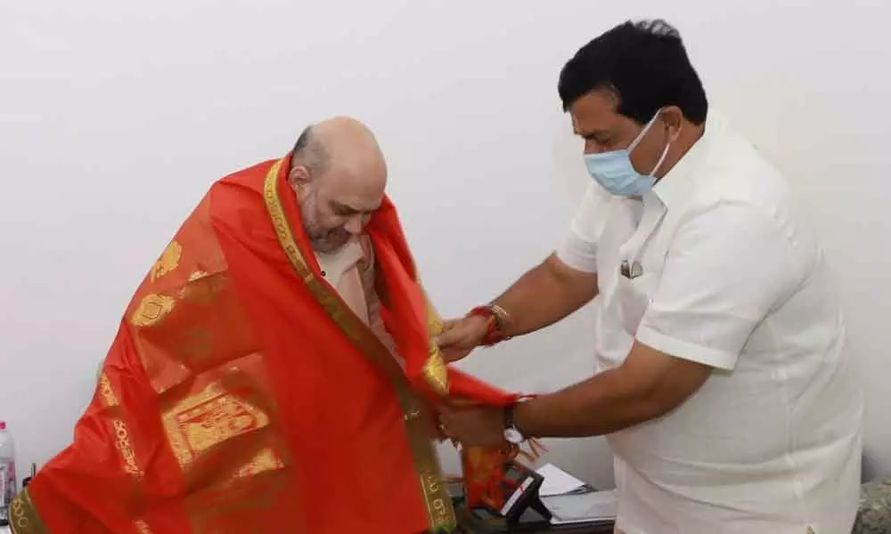 Former MLC Ponguleti Sudhakar Reddy felicitates Union Home Minister Amit Shah in Delhi on Tuesday