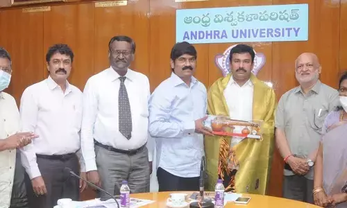 AU VC Prasad Reddy honoring NEDCAP Chairman K K Raju in Visakhapatnam on Tuesday
