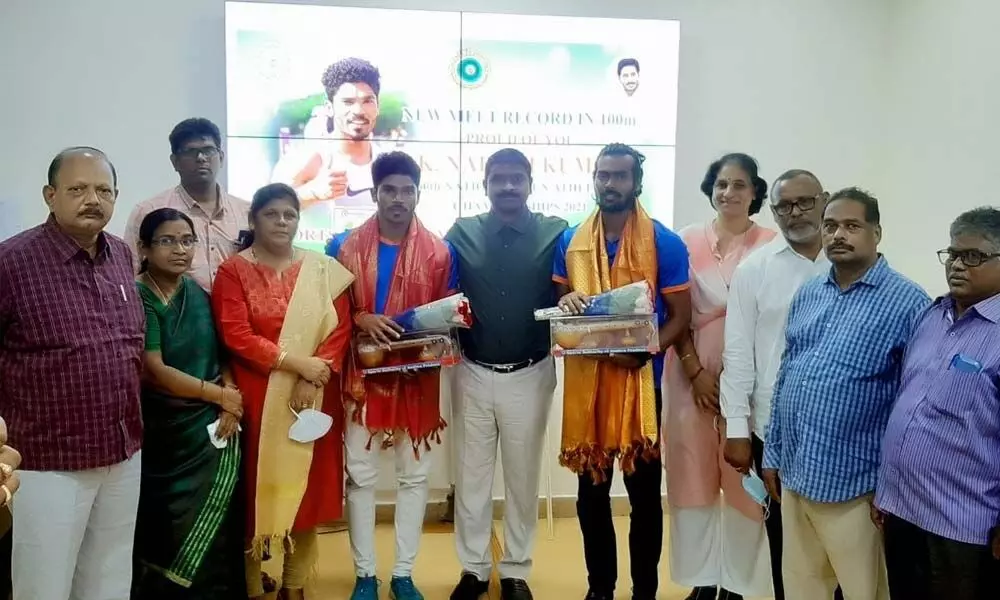 SAAP vice-chairman and managing director Dr N Prabhakar Reddy felicitating the athletes in Vijayawada on Wednesday