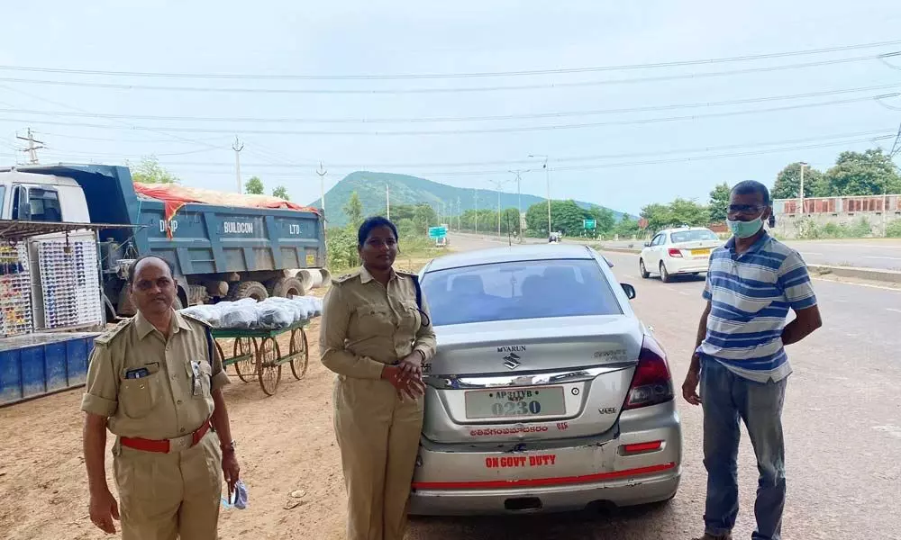 RTO officials registering a case against a vehicle over MV Act violation in Visakhapatnam on Thursday