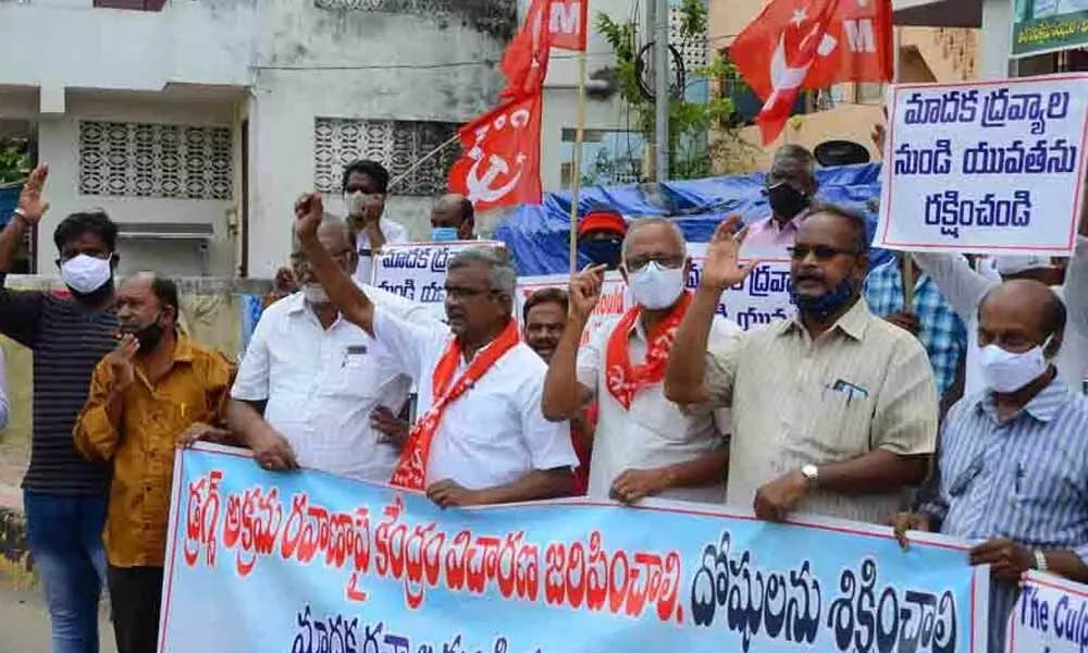 CPM leaders staging protest at BRTS road in Vijayawada on Thursday