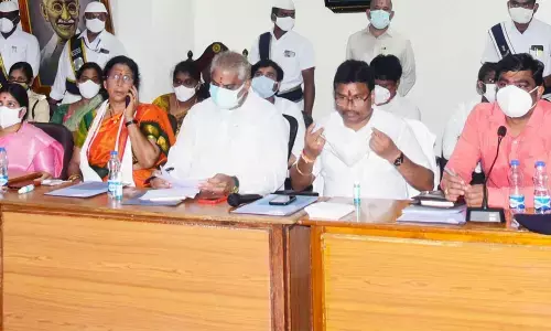 Minister V Srinivas and Collector Nivas addressing the coordination committee meeting in Vijayawada on Thursday