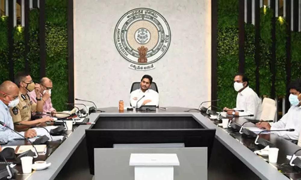 Chief Minister Y S Jagan Mohan Reddy revews Covid control measures, vaccination and other issues at his camp office in Tadepalli on Friday