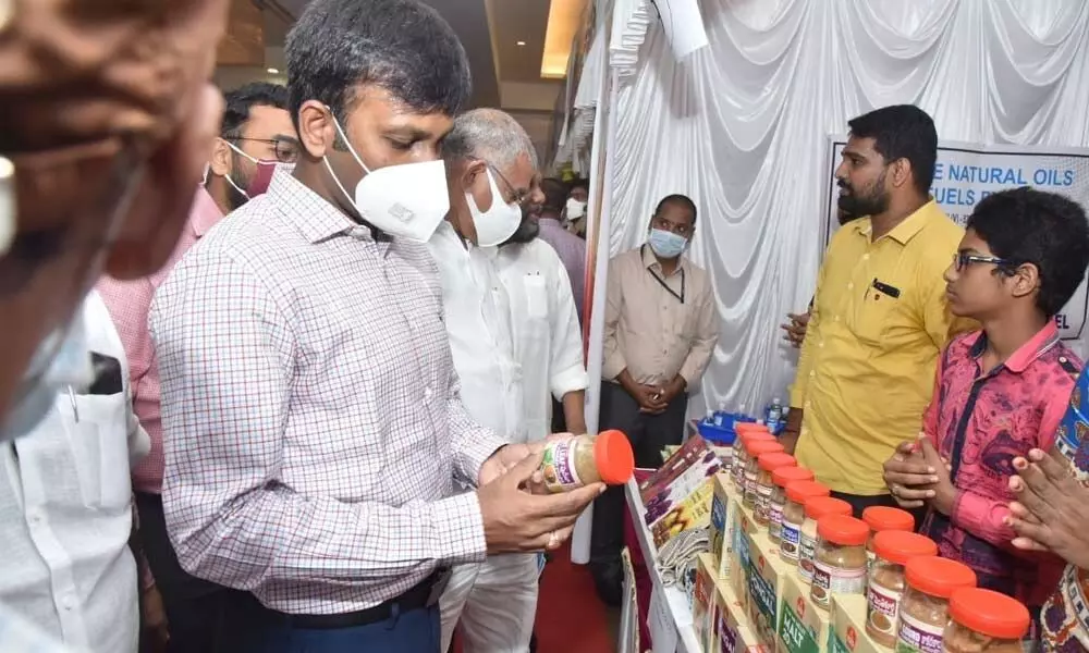 Collector Chevuri Harikiran inspecting a product at Industrial Products Exhibition in Kakinada on Sunday