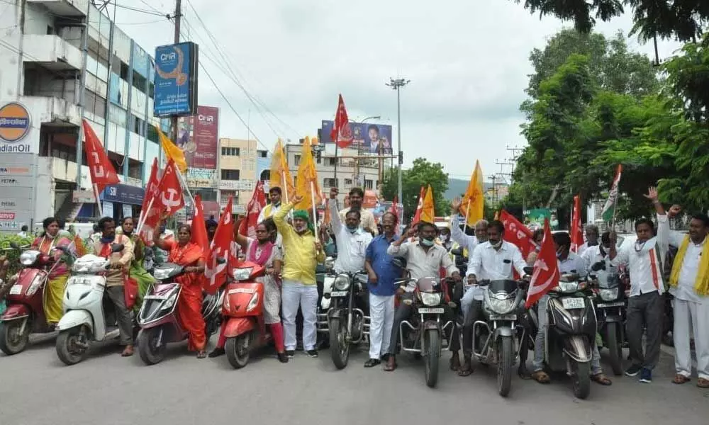 All non-BJP party leaders staging a bike rally in support of Bharath Bandh, in Tirupati on Sunday