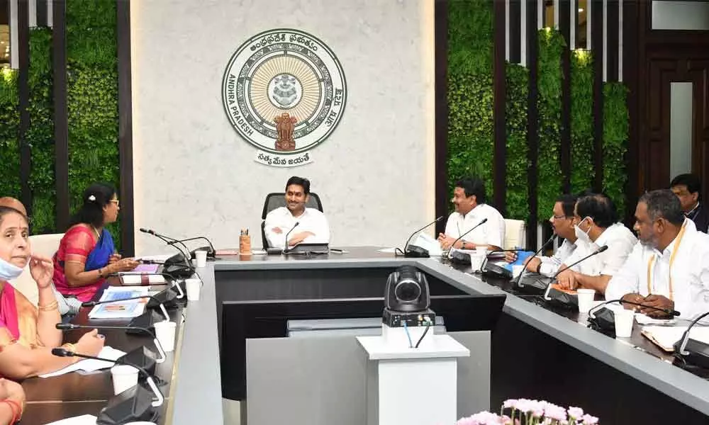 Chief Minister Y S Jagan Mohan Reddy reviews endowments department at his camp office in Tadepalli on Monday. Apart from minister Vellampalli Srinivas, EOs of various temples attend the meet.