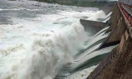 Water gushing out from the gates of Musi project at Ketepally on Monday