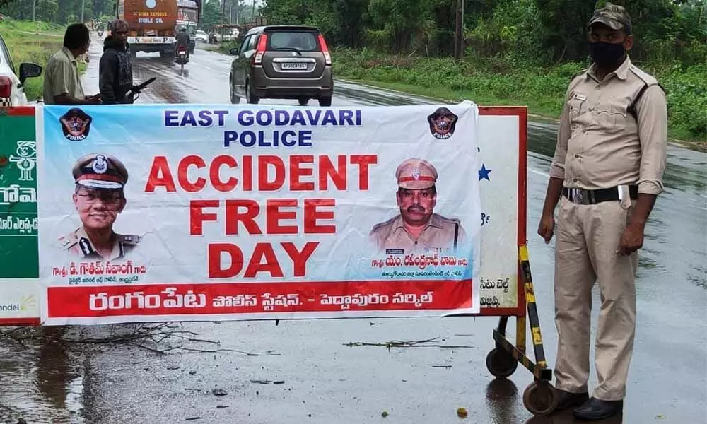 Police personnel on a highway during the Accident-Free Day in East Godavari district on Tuesday