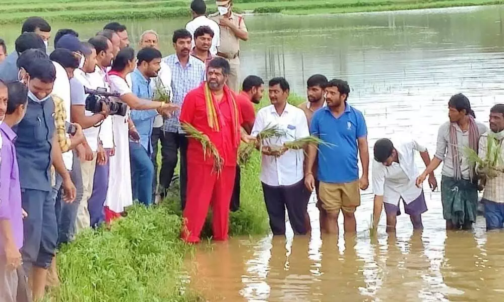 Tourism Minister M Srinivasa Rao visiting flood-affected areas in Bheemunipatnam constituency in Visakhapatnam on Tuesday