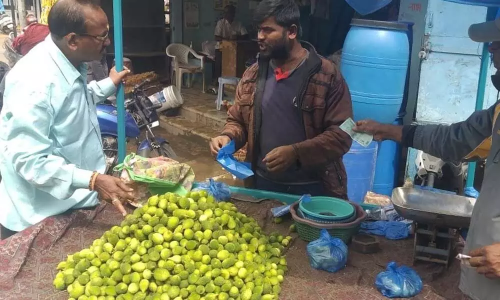 Customer buying Adavikakarikaya in Nizamabad on Tuesday