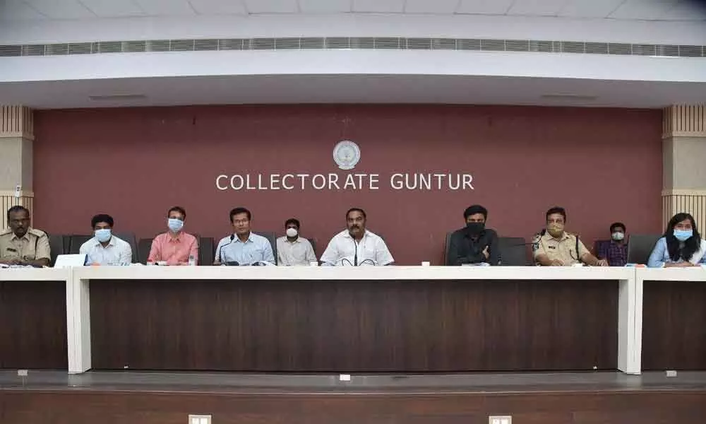 Joint Collector AS Dinesh Kumar addressing district-level Vigilance and Monitoring Committee meeting in Guntur on Wednesday