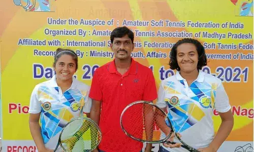 Soft tennis senior nationals bronze medal winners Anusha, Yashaswini with AP Soft Tennis Association secretary Daram Naveen Kumar