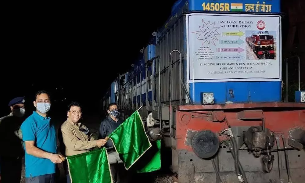 Divisional Railway Manager Anup Kumar Satpathy flagging off the first onion special train in Visakhapatnam on Friday