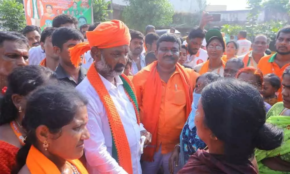 BJP State chief Bandi Sanjay Kumar interacting with people during his Praja Sangrama Yatra in Husnabad on Friday