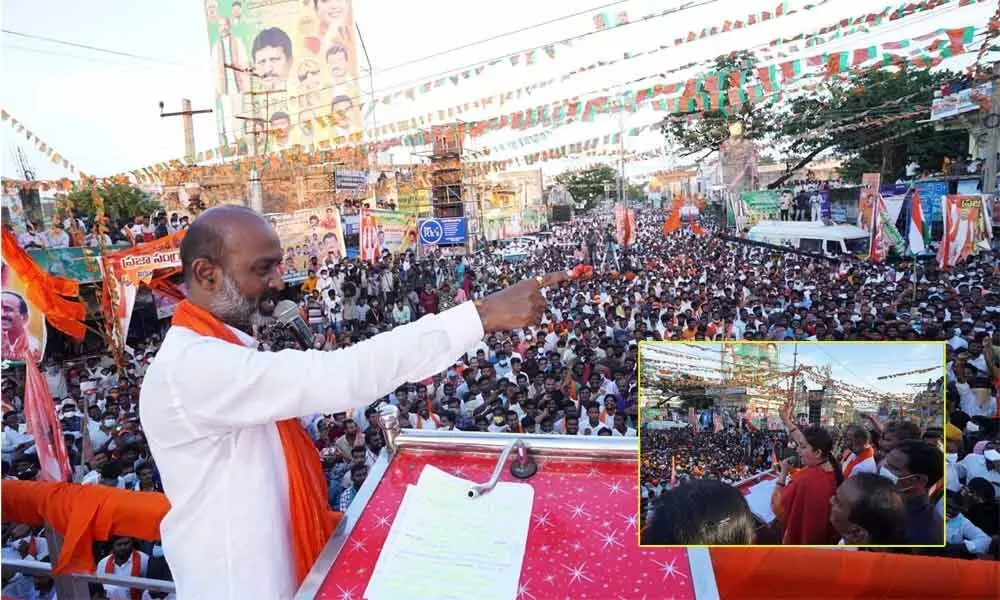 BJP state president Bandi Sanjay Kumar and Union minister Smriti Irani (R) address a public meeting in Husnabad at the end of the first phase of Praja Sangrama Yatra on Saturday