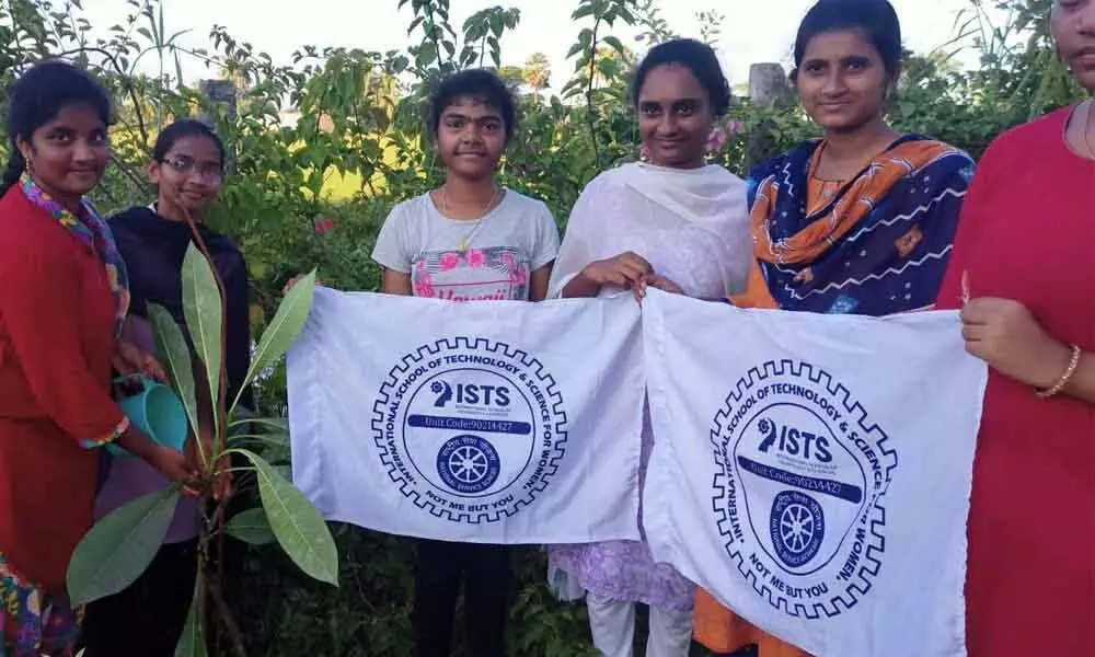 Students take part in a plantation drive at Rajanagaram in East Godavari district on Saturday