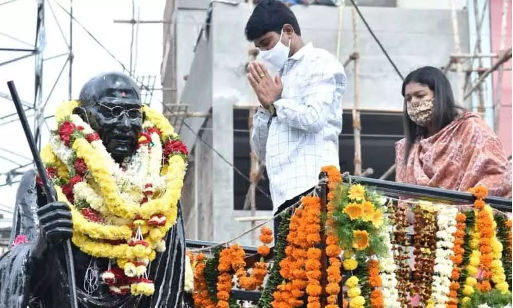 District Collector C Narayana Reddy paying tributes to the statue of Mahatma Gandhi in Nizamabad on Saturday