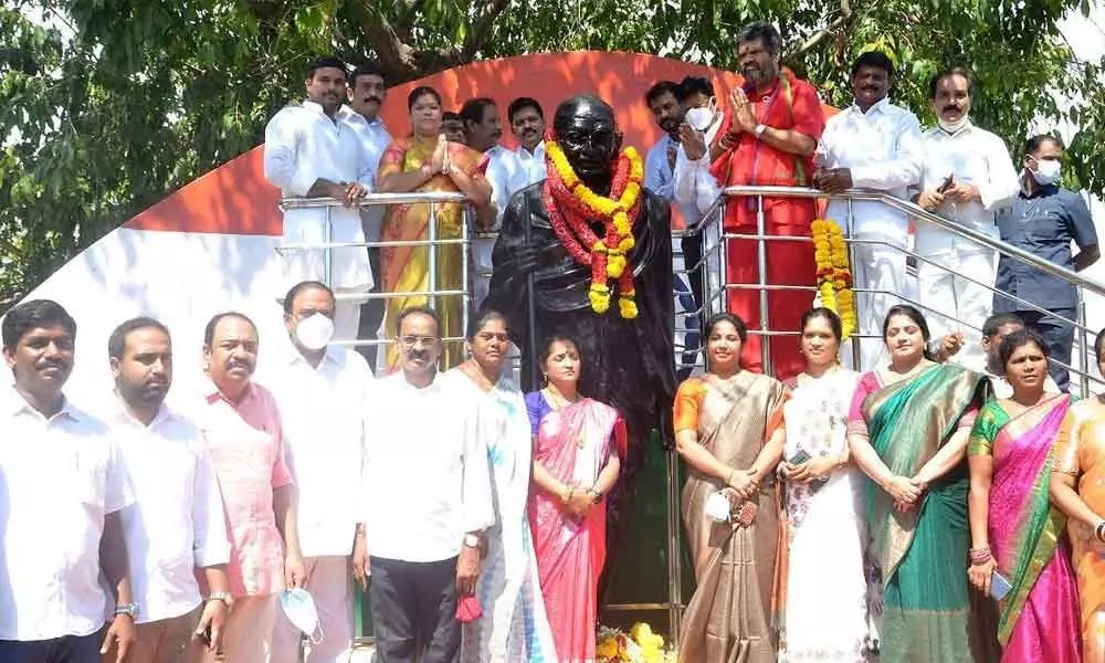 Tourism Minister M Srinivasa Rao paying tributes to Mahatma Gandhi statue near GVMC office in Visakhapatnam on Saturday