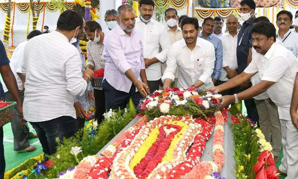 Chief Minister Y S Jagan Mohan Reddy placing a wreath at the memorial of his father-in-law Dr E C Gangi Reddy at Pulivendula town in Kadapa district on Sunday on the occasion of his first death anniversary