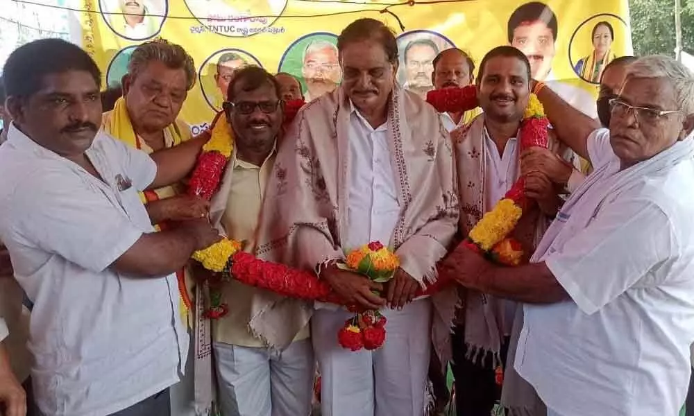 The newly elected ITC BPL TNTUC leaders being felicitated by TDP leaders in Burgumphad on Sunday