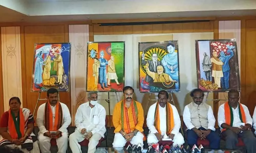 BJP State President Somu Veerraju addressing the media at the party office in Guntur on Monday. Tobacco Board chairman Yadlapati Raghunath Babu also seen