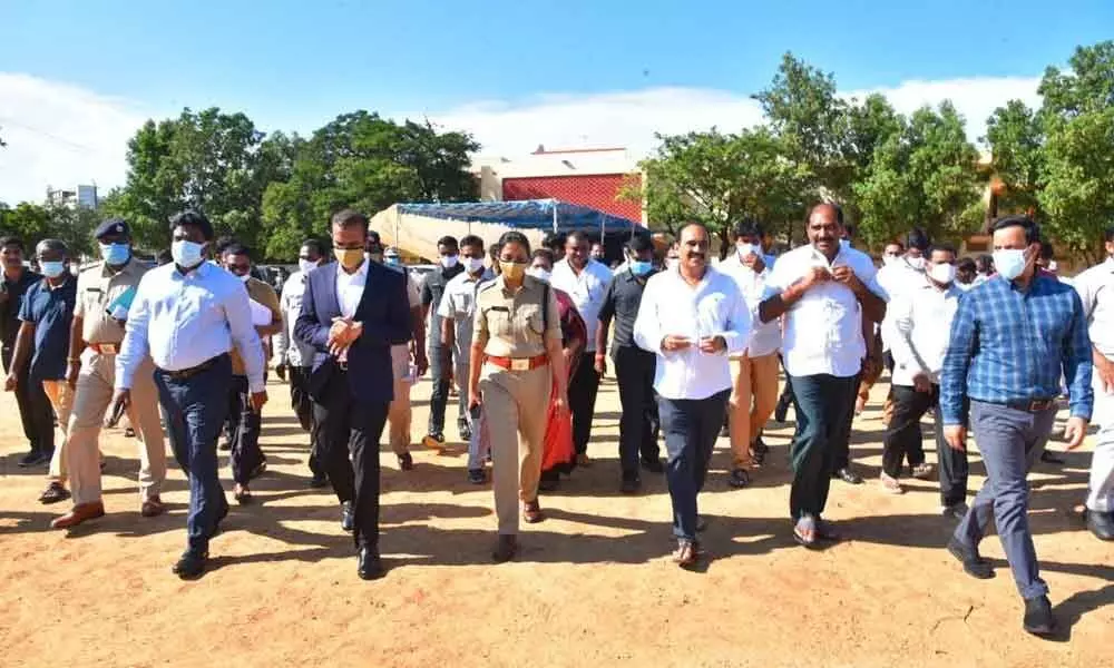 Minister Balineni Srinivasa Reddy and district officials inspecting PVR Boys High School for the Chief Ministers tour in Ongole on Monday