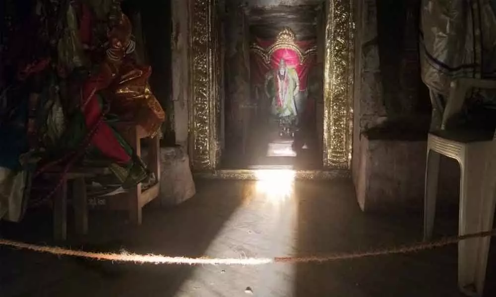 Sunrays touching the feet of Bhavanarayana Swamy in the temple at PedaGanjam on Monday