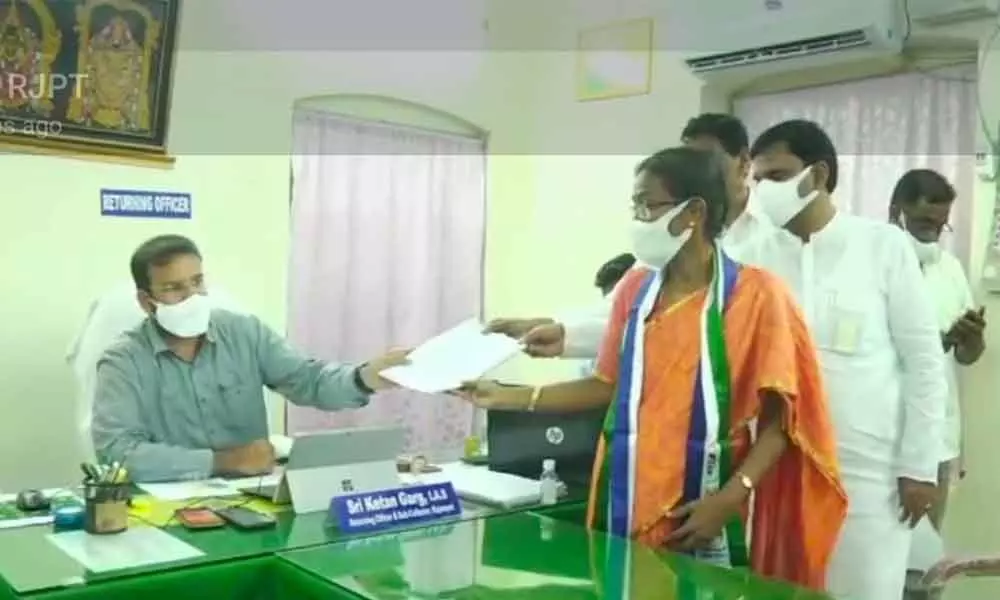 YSRCP candidate Dr D Sudha submitting her nomination papers to returning officer Ketan Garg in Rajampet on Monday