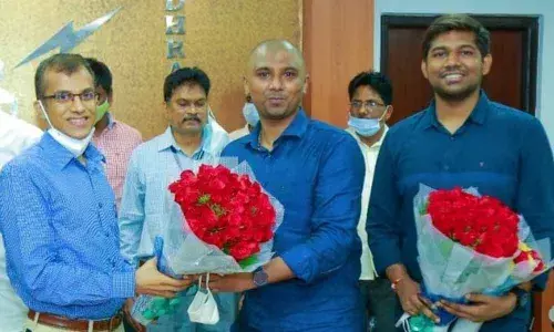 Energy Secretary N Srikanth felicitating the UPSC rankers at Vidyut Soudha in Vijayawada on Sunday