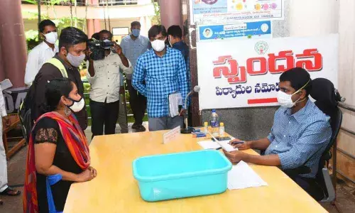 District Collector M Hari Narayanan receiving the petitions at Spandana programme held at the Collectorate in Chittoor on Monday