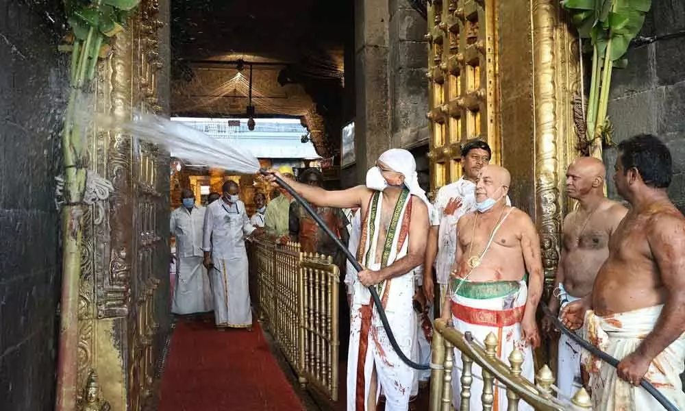 TTD temple staff led by executive officer  Dr K S Jawahar Reddy clean in Tirumala temple on the occasion of Koil Alwar Thirumanjanam on Tuesday