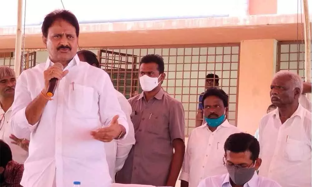 Rajya Sabha Member Mopidevi Venkata Ramana Rao addressing a meeting at Nizampatnam Port in Guntur district on Tuesday