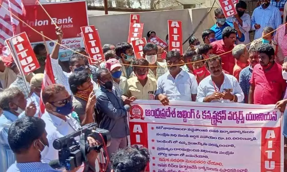 AP construction workers staging a protest in Visakhapatnam on Tuesday