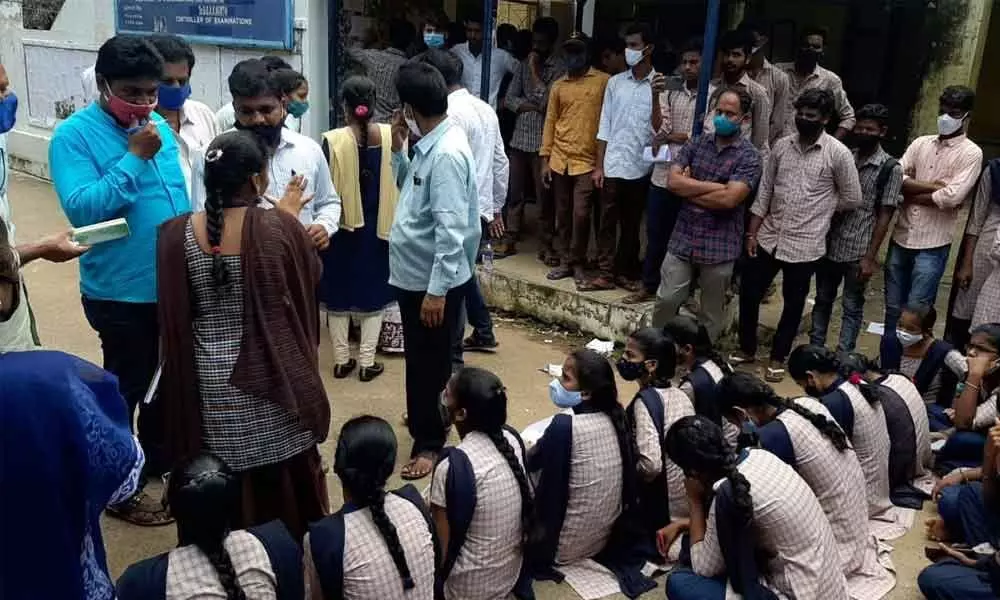 The students of Maharaja Degree College staging protest at the principal office on the campus in Vizianagaram on Tuesday