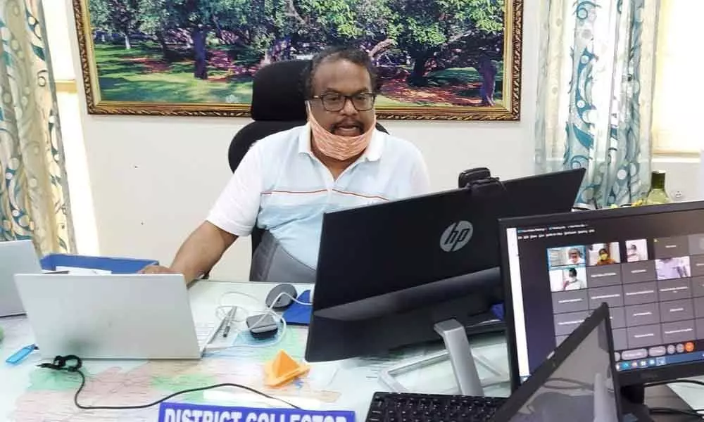 District Collector S Venkat Rao participating in a meeting through video conference in Mahbubnagar on Tuesday