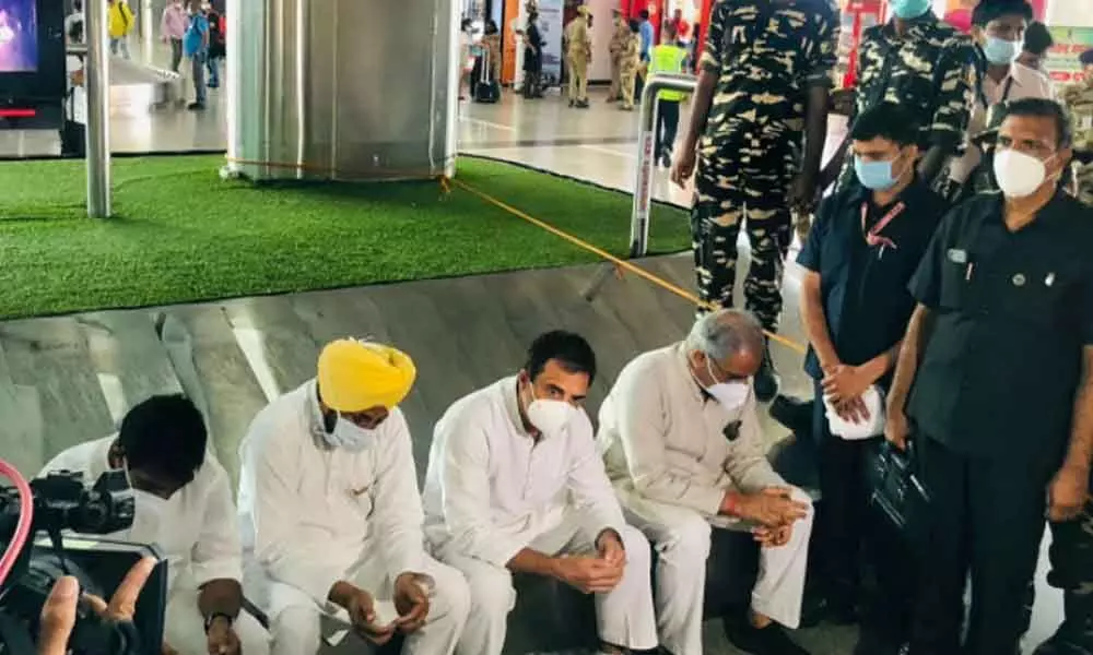Congress leader Rahul Gandhi along with Punjab CM Charanjit Singh Channi and Chhattisgarh CM Bhupesh Baghel at Lucknow airport