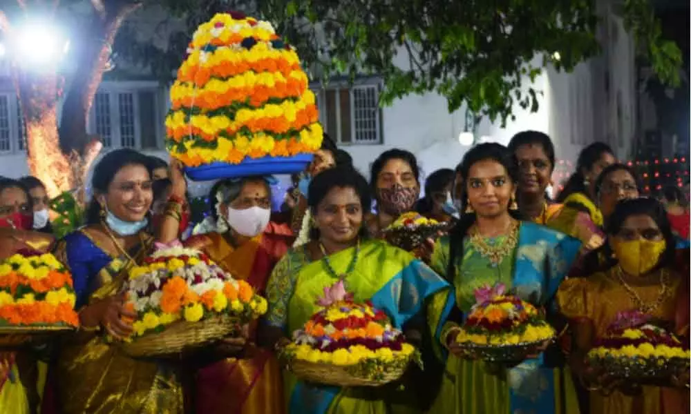 Governor Tamilisai Soundararajan along with Raj Bhavan pariwar participates in Bathukamma celebrations at Raj Bhavan on Wednesday. Photo: Ch Prabhu Das