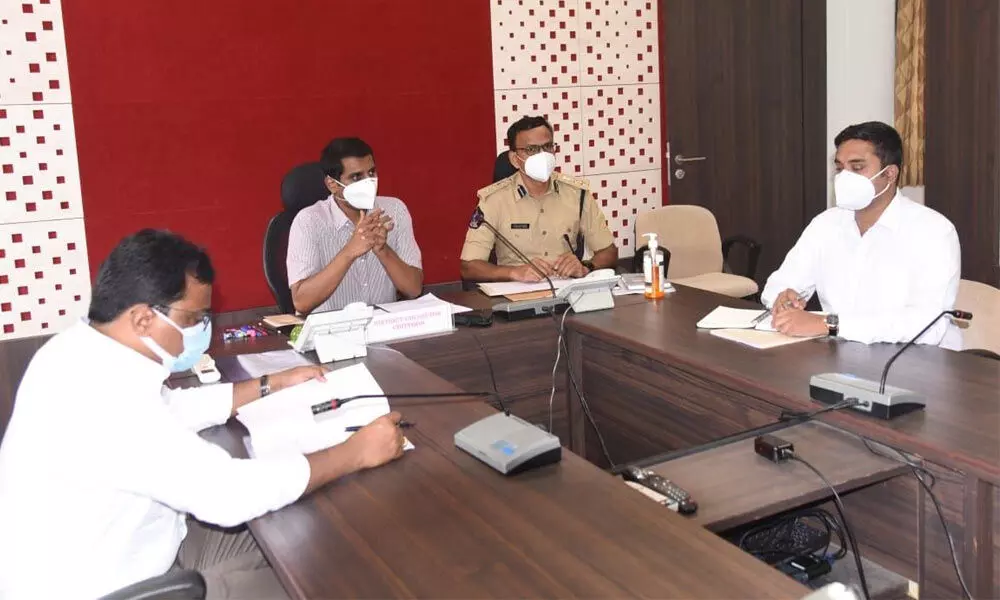 District Collector M Hari Narayanan holding a review with the officials including SP Senthil Kumar and Joint Collector Raja Babu at the Collectorate in Chittoor on Wednesday