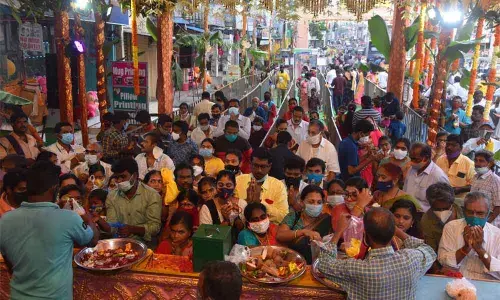 Devotees queue up to have darshan of presiding deities