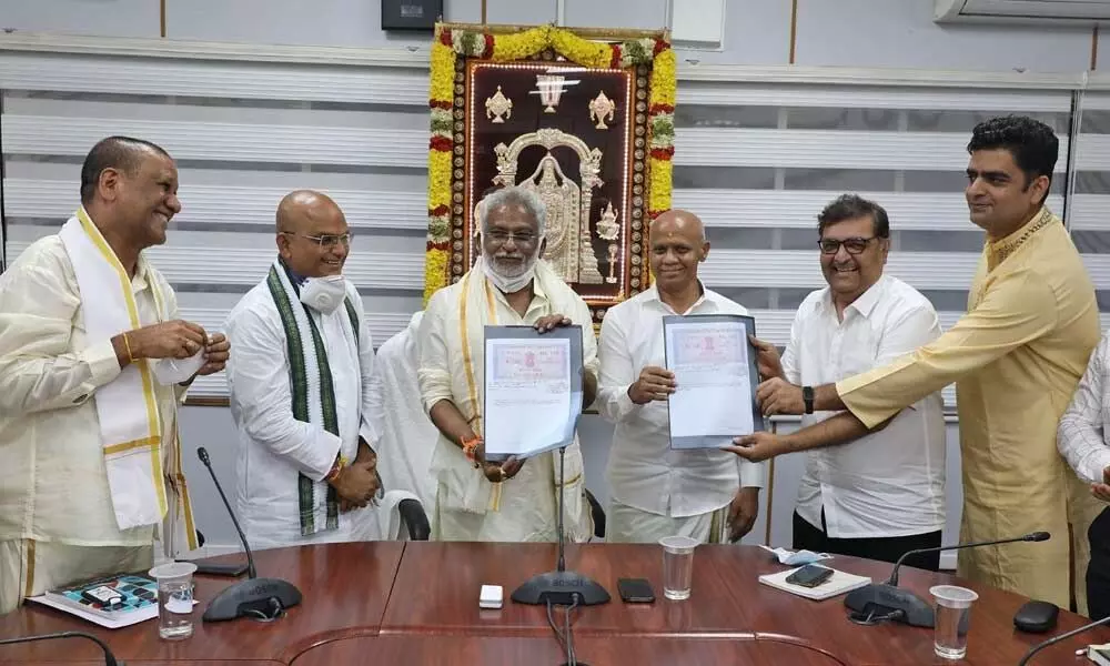 TTD chairman Y V Subba Reddy, Additional EO A V Dharma Reddy and representatives of Jio displaying copies of MoU at Annamaiah Bhavan at Tirumala on Friday. TTD EO K S Jawahar Reddy is also seen