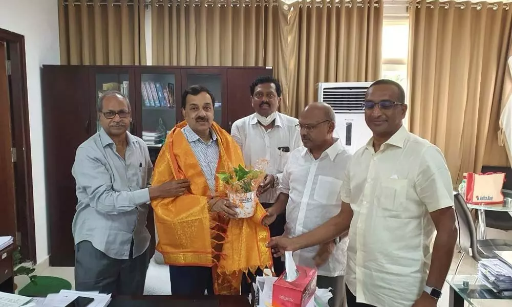 CREDAI State Chairman S Venkatramaih and others felicitating Special Chief Secretary to Government Rajat Bhargava at Secretariat on Friday