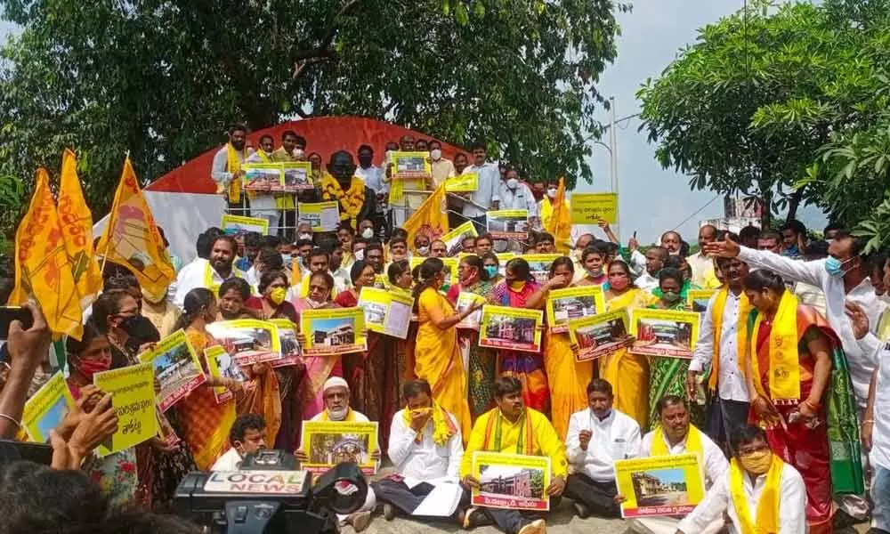 TDP’s Visakhapatnam Parliamentary Committee leaders staging a protest at the Gandhi statue in Visakhapatnam on Saturday