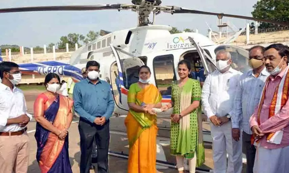 Krishna District Collector J Nivas, Mayor R Bhagyalakshmi, Municipal Commissioner V Prasanna Venkatesh, and Kanaka Durga  temple Executive Officer D Bhramaramba inaugurating  heli ride at IGMC Stadium  in Vijayawada on Saturday