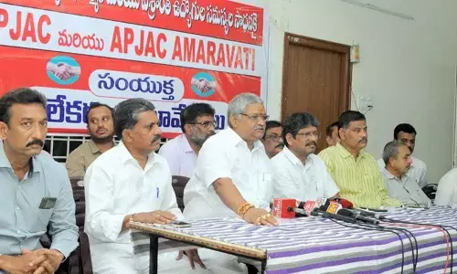 NGO state president Bandi Srinivasa Rao, AP JAC Amaravati chairman Bopparaju Venkateswarlu  and other JAC leaders addressing a press conference at NGO Home in Vijayawada on Saturday  	(Photo: Ch Venkata Mastan)