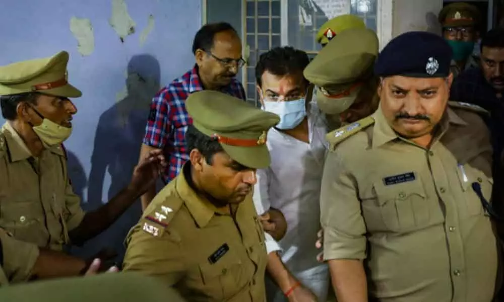 Ashish Mishra (centre) arrested by the police