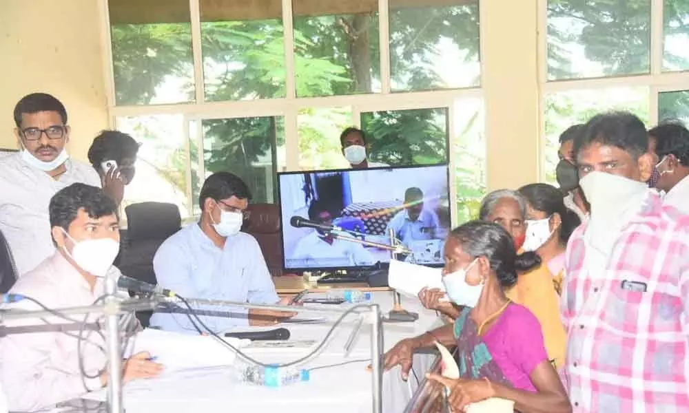 District Collector A Mallikarjuna interacting with the petitioners at Spandana programme held at Narsipatnam on Monday
