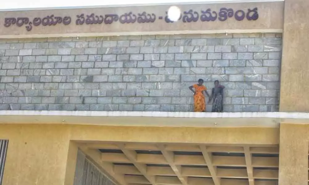 Two women climb collectorate in protest