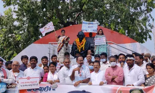 JSP leaders staging a protest against mortgaging government assets in Visakhapatnam on Monday